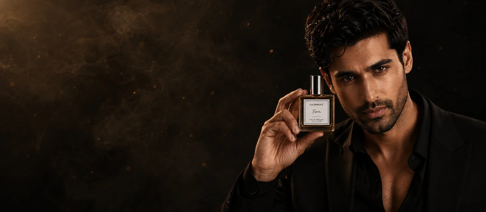 Man holding Alice and Bruce Ferox luxury perfume in a dark cinematic setting wearing a black suit